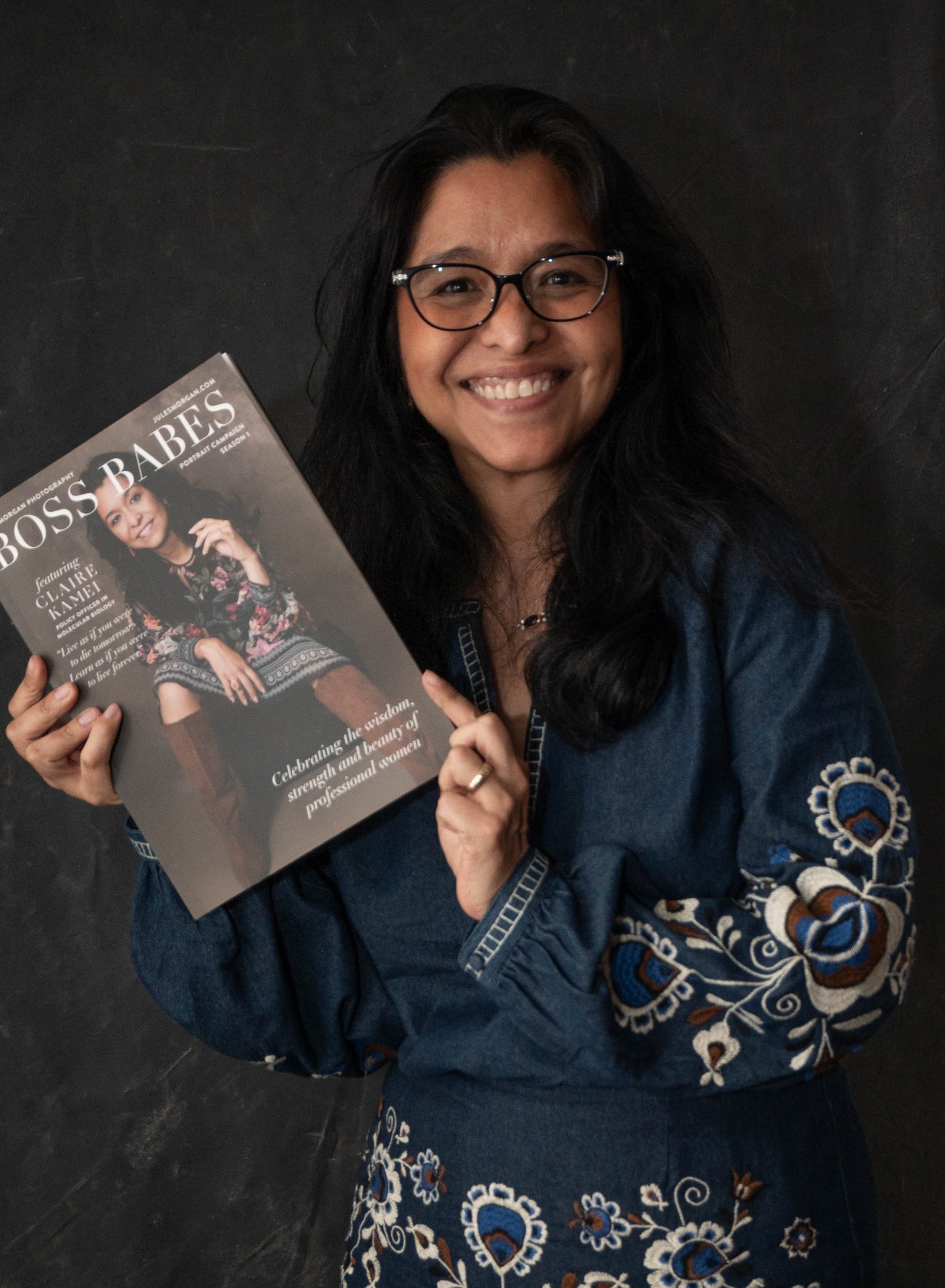 A Boss Babe holding her magazine cover