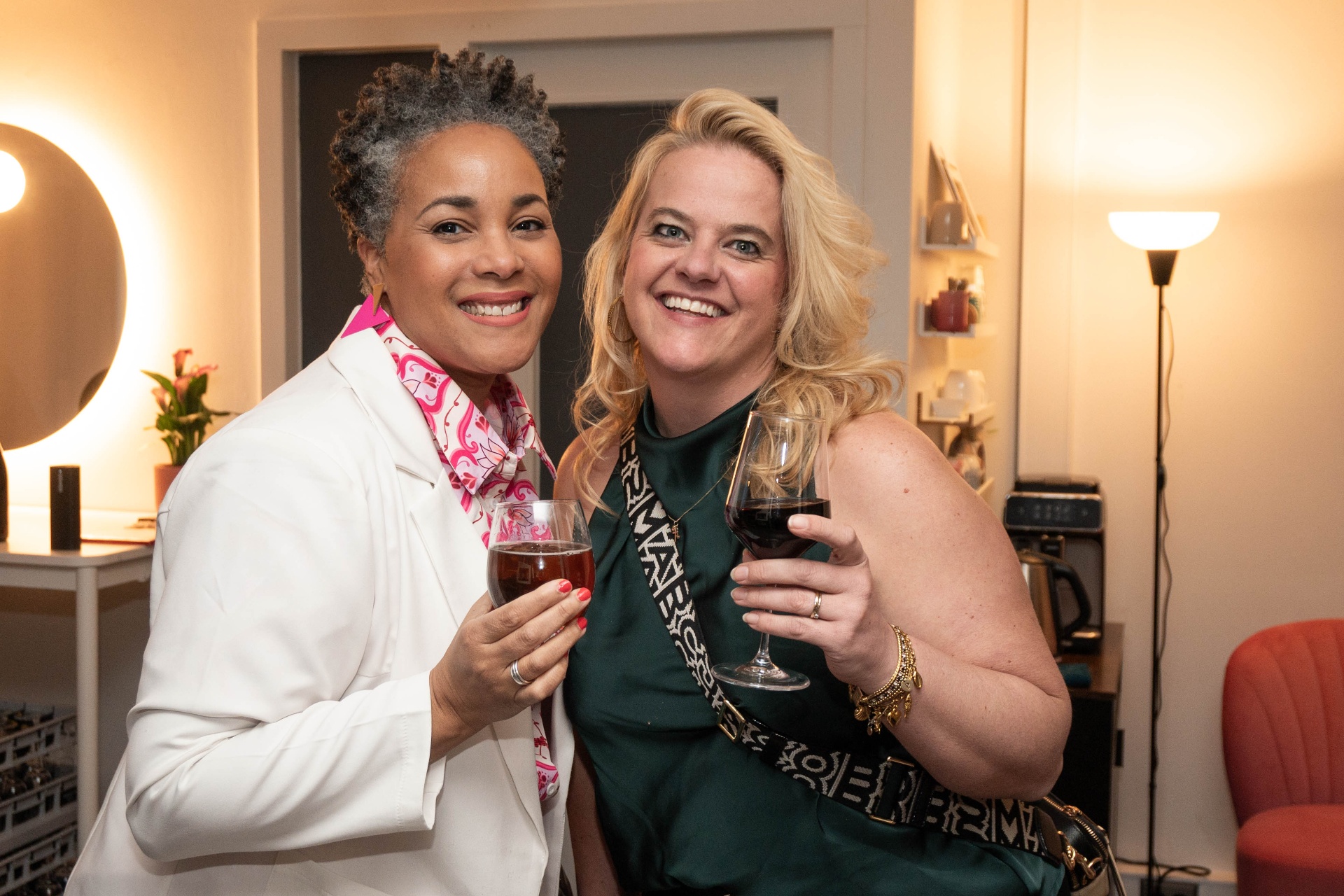 Two Boss Babes sharing a toast at the launch