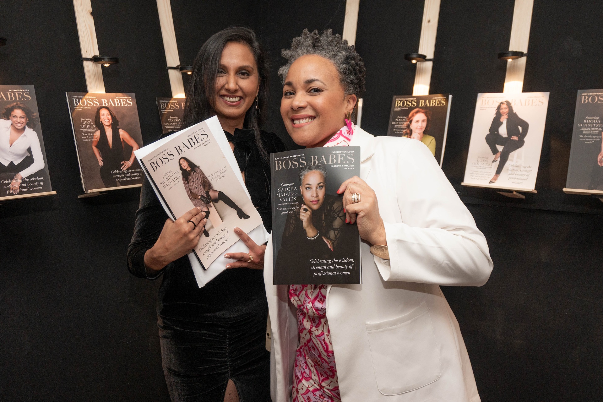 Two Boss Babes proudly holding their magazine covers